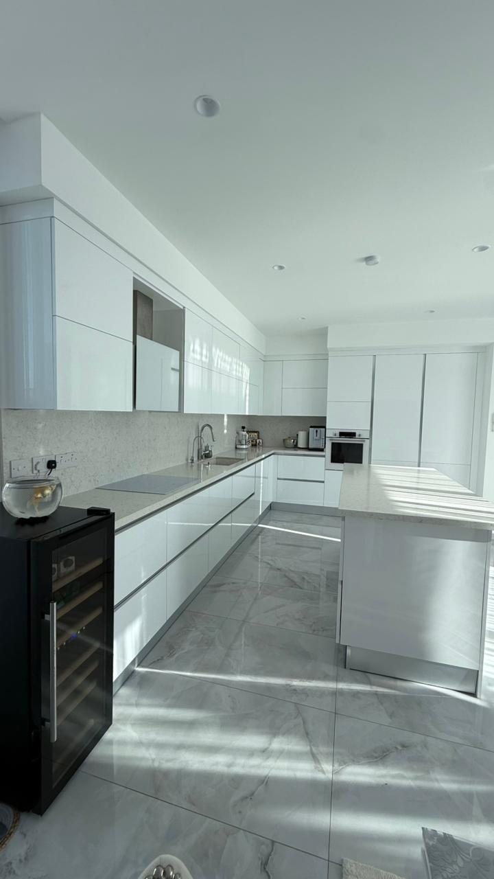 White kitchen with Bosch appliances and wine cooler