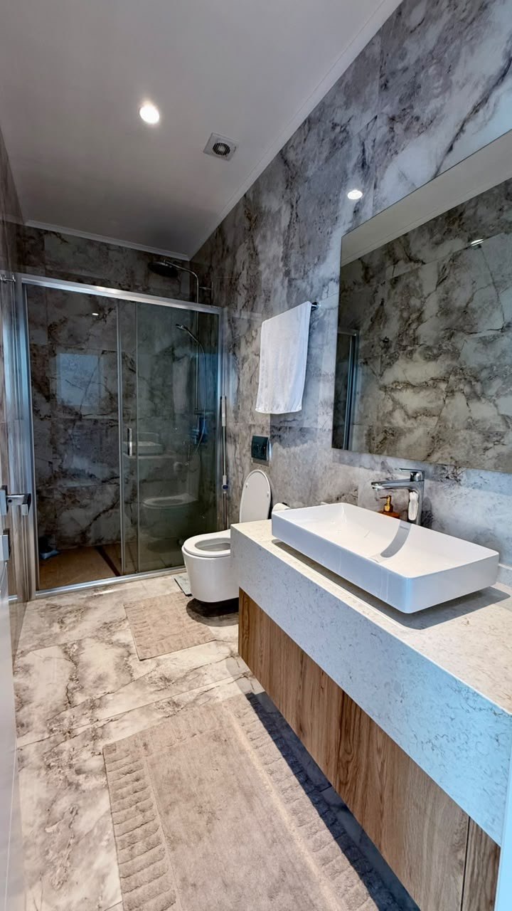 Marble bathroom with walk-in shower