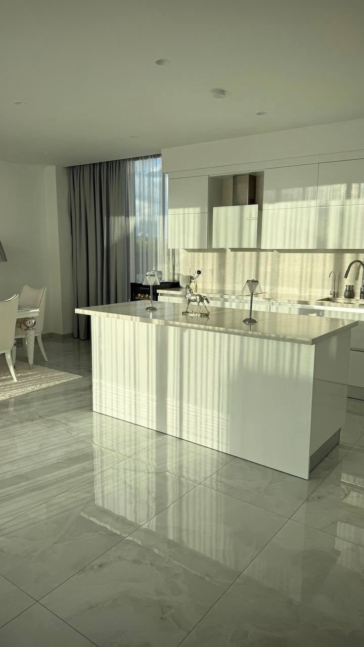 White kitchen island with Bosch appliances